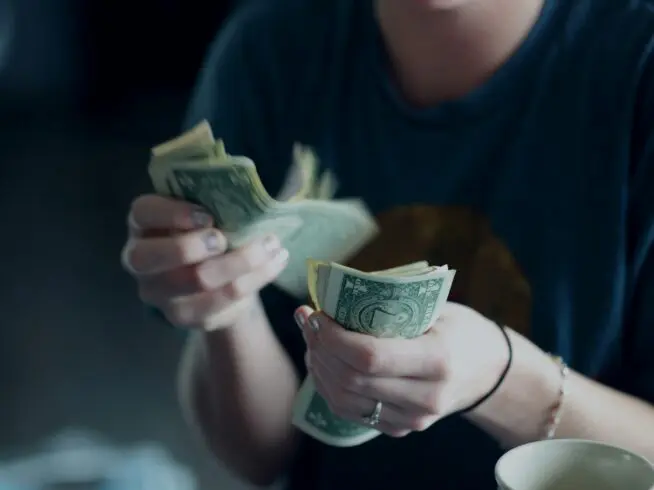 A person counting money.