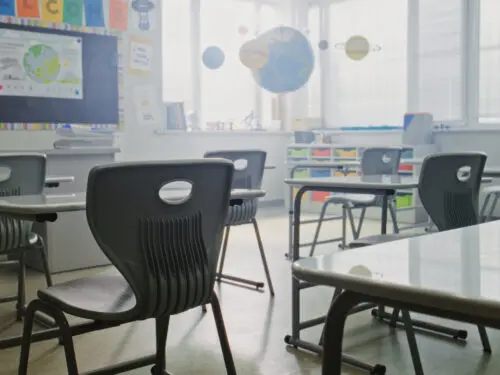 Interior of an empty primary school classroom.