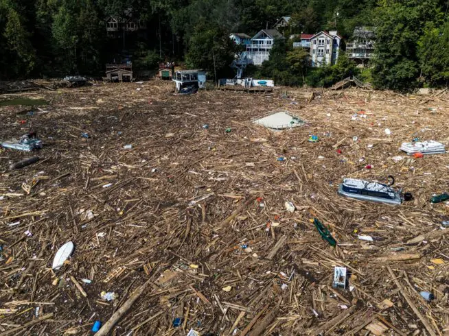 Debris is strewn on the lake in the aftermath of Hurricane Helene, Oct. 2, 2024, in Lake Lure, North Carolina.
