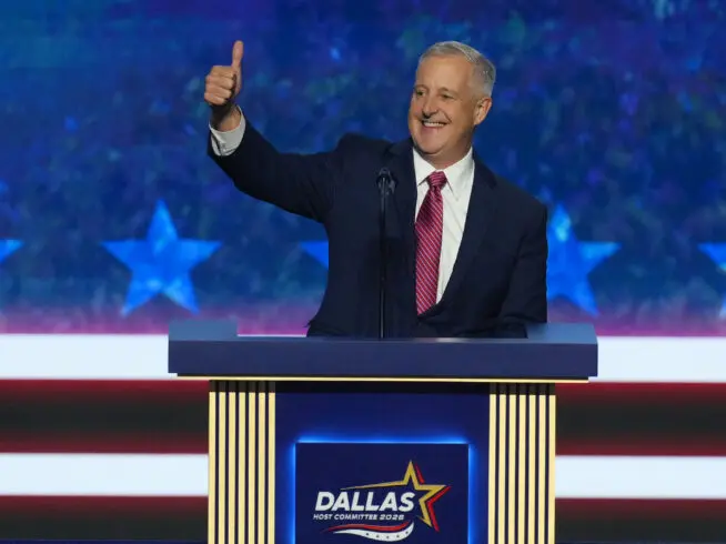 Michael Whatley, North Carolina senatorial candidate, greets delegates as he takes the stage at the Republican convention in Dallas, Wednesday, Sept. 9, 2026.